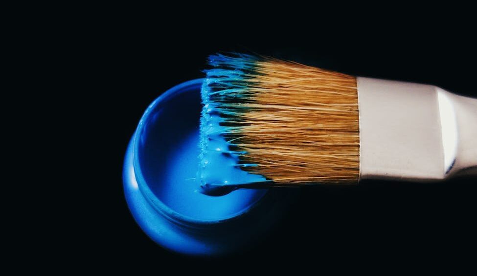 blue paint on a brush