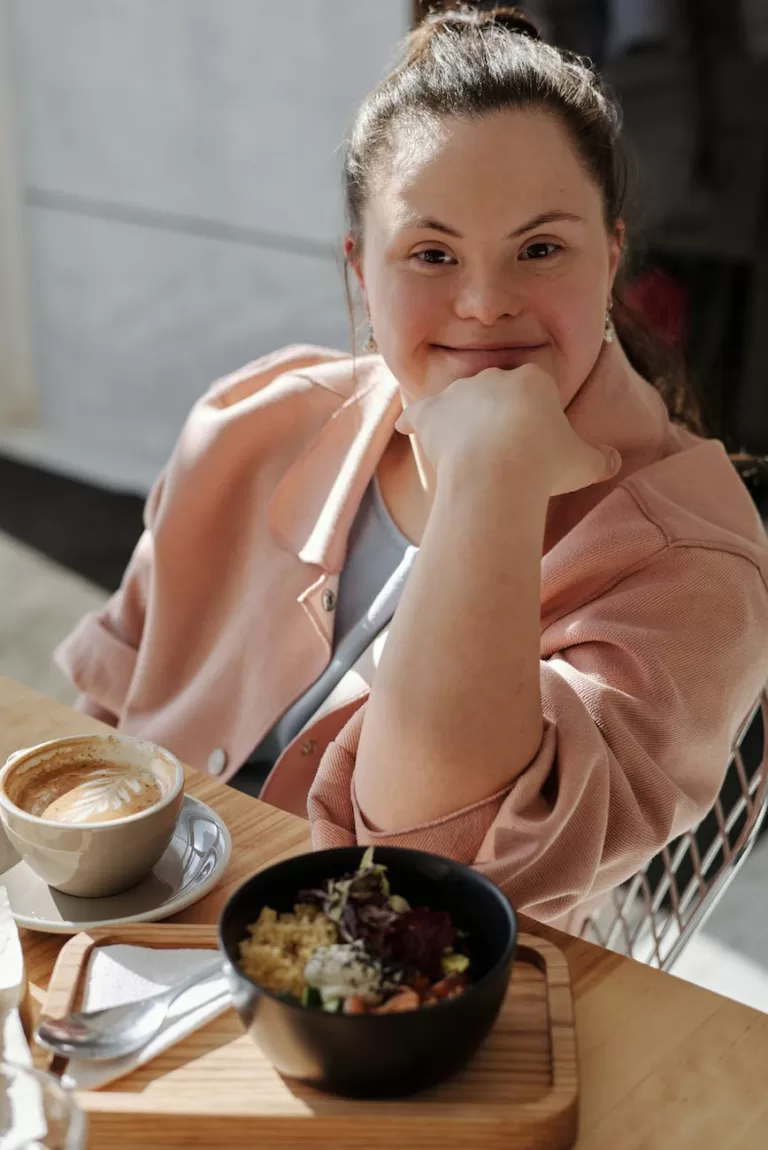 woman having coffee and rice bowl