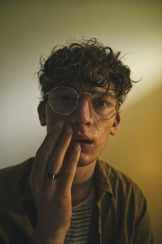 portrait of a man wearing wet eyeglasses